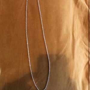 Men’s or women 2mm 24 in tennis necklace dipped in 14kt gold and sapphire.